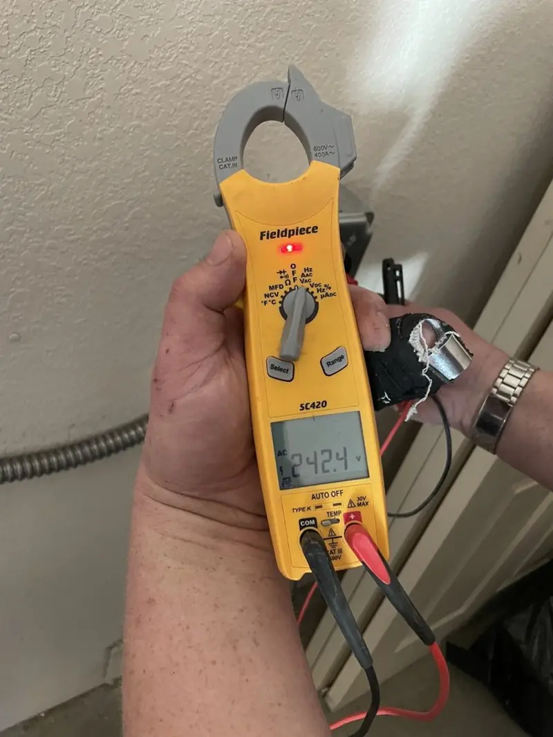 Voltage testing with clamp meter during Ceiling Fan Installation in Hempfield